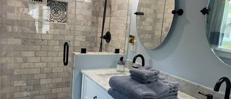 Shower, hair dryer, towels, soap
