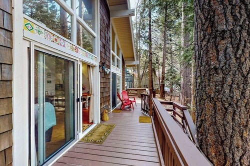 Dog-friendly cabin surrounded by trees and wildlife with fireplace & deck