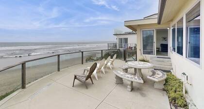Classic waterfront beach house with a furnished deck & ocean views