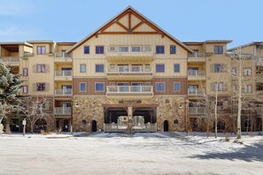A multi-story hotel with balconies, a stone facade, and a sign reading 'Red Hawk.' - Cozy Ski-In/Ski-Out Condo with WiFi, Pool, & Hot Tub (Keystone)