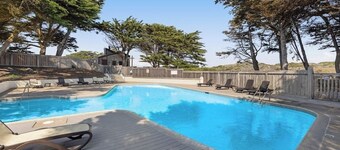Beachfront condo with private patio, beach access, shared pool & hot tub.
