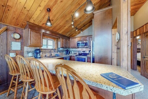 Ski-in/ski-out condo with lake and mountain views, woodstove