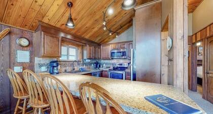 Ski-in/ski-out condo with lake and mountain views, woodstove