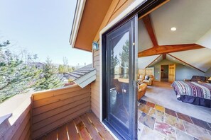 A bedroom with a large window, a wooden ceiling, and a view of the outdoors. - Large Lodge-Style Home Near Ski Resorts w/Private W/D - Dog Friendly (Frisco)