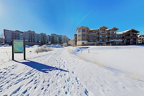 A snow-covered landscape with a ski resort building featuring multiple floors and balconies. - Premier Lake Dillon Condominium, 20 Min Access To 5 Resort Towns (Frisco)