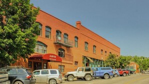 A red brick building with a storefront named 'Jarvis.'
