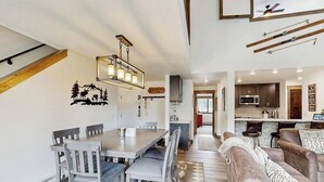 A modern kitchen with dark cabinets, a microwave, and a countertop. - Handsome Condo w/WiFi, Deck, Shared Pool, Hot Tub, & Sauna - 2 Miles to Keystone (Keystone)