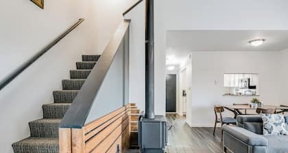 Two-Level Condo w/ Mountain View, Wood Stove, WiFi, Laundry & Central Location