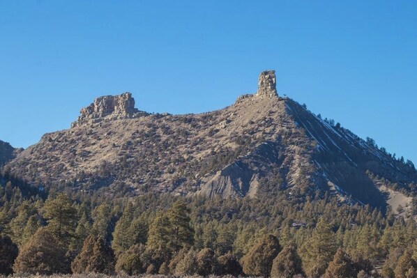 A mountainous landscape with two prominent rock formations. - Dog-friendly condo w/ covered porch & views - near golf, lakes & ski (Pagosa Springs)