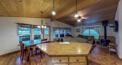 Waterfront cabin with private hot tub, furnished deck, wood stove, & free WiFi