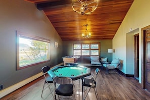 A room with a pool table, a foosball table, and a large window with a view. - Mountain View Home w/ jetted tub, air hockey, foosball near Wolf Creek (Del Norte)