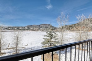 A snowy landscape with a mountain in the background, a clear sky, and a metal railing in the foreground. - Dog-Friendly Golf Course Front Home w/Free WiFi, Gas Fireplace, W/D, & Gas Grill (South Fork)