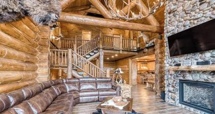 Custom riverfront log home w/ hot tub, decks & fireplace