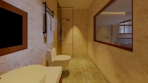 A modern bathroom with a bathtub, toilet, and shower.