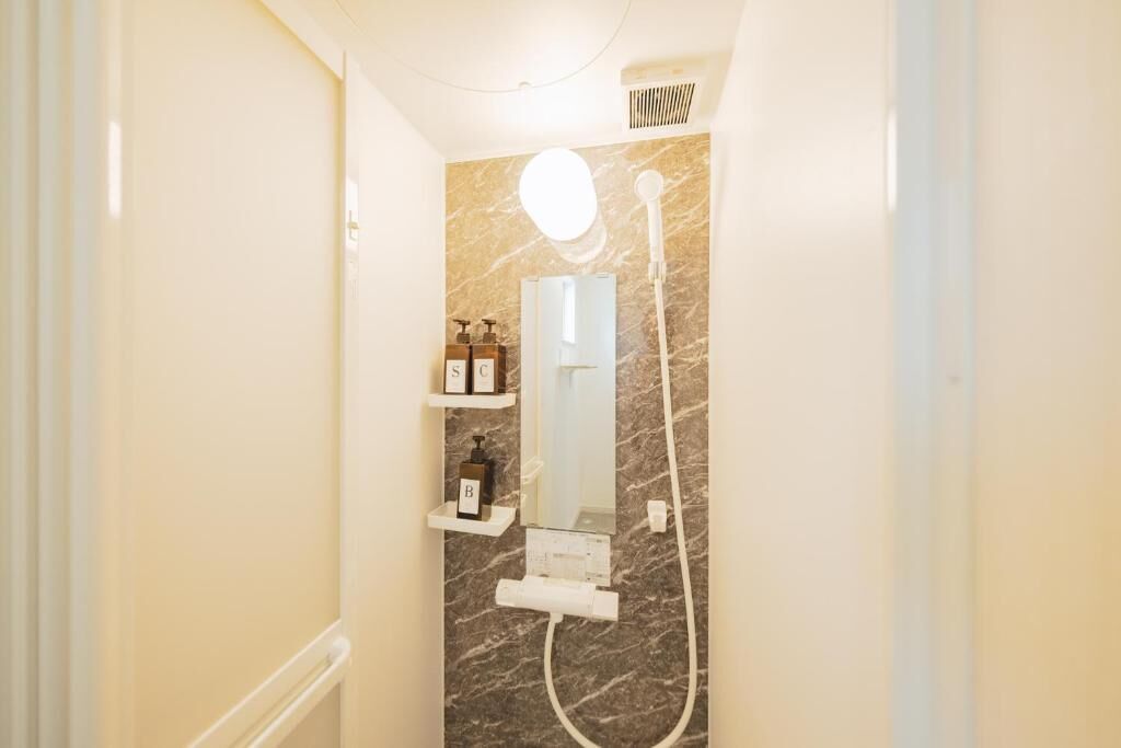 Shower, free toiletries, slippers, towels