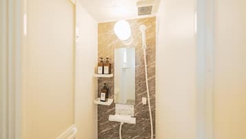 Shower, free toiletries, slippers, towels