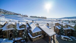 A snow-covered residential area with houses and a clear sky. - Two-Story Ski-In Condo w/Free WiFi, Gas Fireplace, Private W/D, Shared Hot Tub (Steamboat Springs)