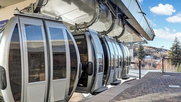 A cable car station with open car doors, metal railings, and a paved platform. - Beaver Creek West Condo with Heated Pool, 3 Hot Tubs & Shuttle to the Slopes (Avon)