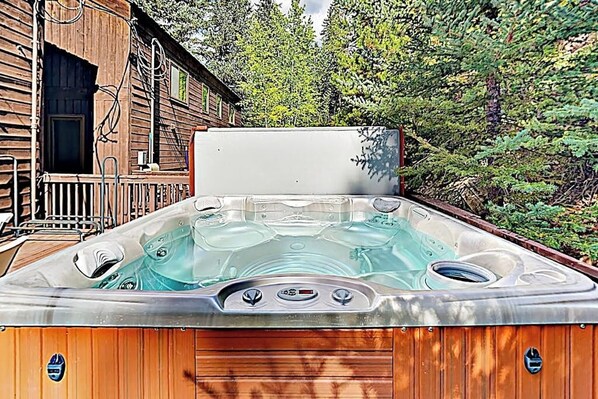 A hot tub with a wooden exterior, a metal railing, and a wooden deck. - Spacious Townhome with Hot Tub, Adjacent to Gore Creek | 4.5 Miles to Vail (Vail)