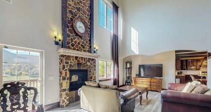 Luxe home on Gypsum Creek Golf Course with fireplace and mountain views