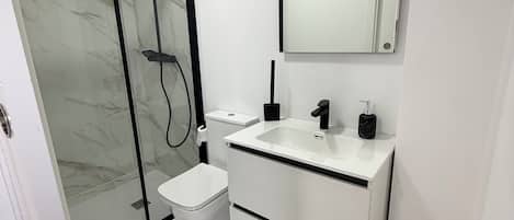 Shower, towels, soap, toilet paper