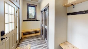 A narrow hallway with a bench, wooden shelves, and a window. - Two-level home on one acre w/ mountain views and deck on Crystal River (Carbondale)