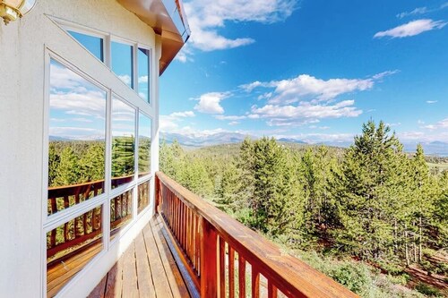 Gorgeous home with a stunning lake & mountain view, deck & gas fireplace