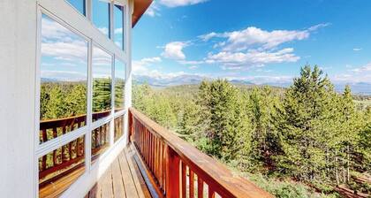 Gorgeous home with a stunning lake & mountain view, deck & gas fireplace