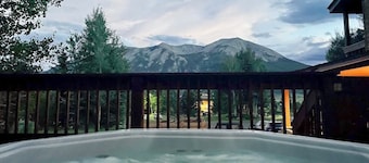 Mountain-view condo with hot tub - drive minutes to slopes & trails