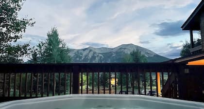 Mountain-view condo with hot tub - drive minutes to slopes & trails