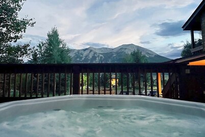 Mountain-view condo with hot tub - drive minutes to slopes & trails