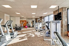 A gym with treadmills, elliptical machines, and weight equipment. - Main Street condo with mountain view, fireplace, pool & hot tubs - walk to lifts (Breckenridge)