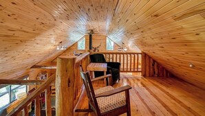 A wooden interior with a high ceiling, a staircase, and a seating area with a table and chairs. - Dog-Friendly Cabin w/ Washer/Dryer, WiFi, & Firepit - Steps From the Rio Grande (South Fork)