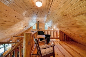 A wooden interior with a high ceiling, a staircase, and a seating area with a table and chairs. - Dog-Friendly Cabin w/ Washer/Dryer, WiFi, & Firepit - Steps From the Rio Grande (South Fork)