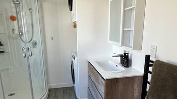 Shower, towels, soap, toilet paper