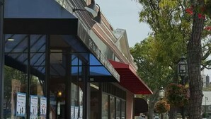 A cafe with outdoor seating, a glass storefront, and a brick facade. - Private Suite with Full Bath & Separate Entrance –  close to Tufts University (Winchester)