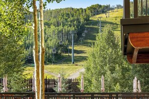 A view of a ski lift, trees, and a wooden structure. - Ski-In/Ski-Out Villa w/ Fireplace, High-Speed WiFi & Shared Hot Tub, Pool, & W/D (Vail)