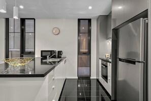 Apartamento luxo, sacada | Cozinha privada