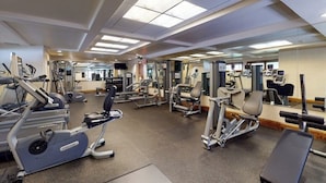 A gym with various exercise equipment, including treadmills, weight machines, and free weights. - Ski-in/out, mountain view condo w/ fireplace, fast WiFi, shared pool/WD/hot tub (Vail)
