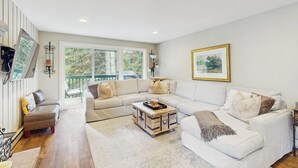 A living room with a sectional sofa, a coffee table, and a fireplace. - Beautiful East Vail Condo w/ Vail Village Ski Lockers/Free WiFi/Near Ski Shuttle (Vail)