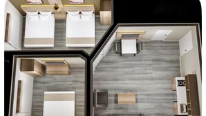 A hotel room with two beds, a desk, a sofa, and a TV. - Newly Renovated Hotel - 2 Bedroom Suites with Kitchen in beautiful Columbia (Columbia)
