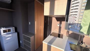 Superior Quadruple Room, City View | Private kitchen