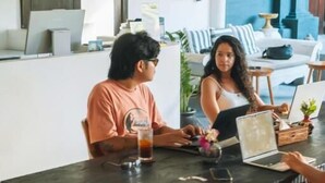A modern interior with a dining table, chairs, and a laptop. - Co Day Uluwatu  (Pecatu)
