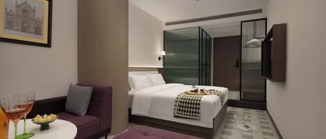 Une chambre d’hôtel moderne équipée d’un lit, d’un canapé, d’une petite table avec des verres et d’une télévision.