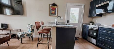 Coffee/tea maker, fridge, microwave, oven