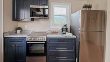 Coffee/tea maker, fridge, microwave, oven