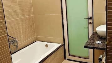 Luxury Suite, City View | Bathroom | Free toiletries, towels, soap, toilet paper
