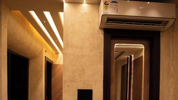 Luxury Suite, City View | Living area | 32-inch Smart TV with satellite channels