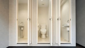A modern bathroom with a toilet, sink, and shower. - Guesthouse Akasaka2 (Tokyo)