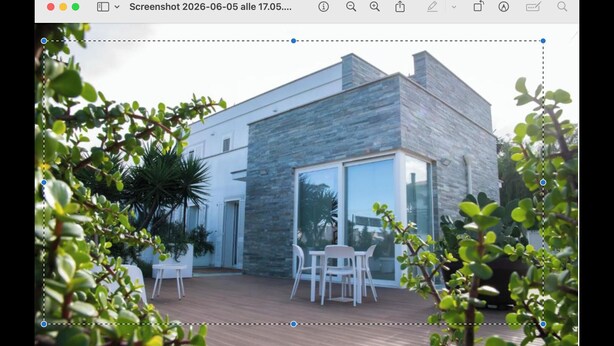 A modern house with a patio, white furniture, and a view of the sky. - Borgo dei Cedri (Bari)